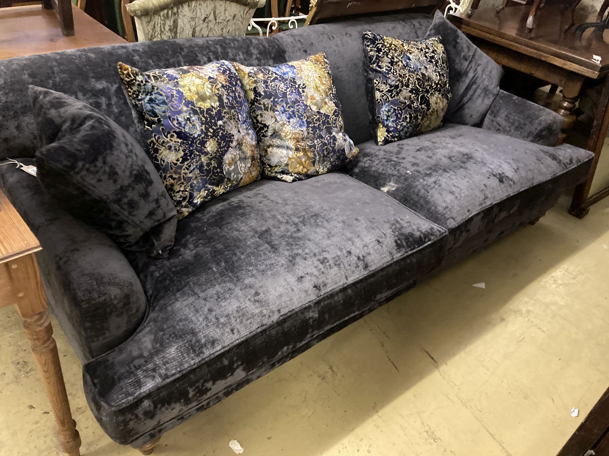 A modern contemporary large sofa upholstered in dark blue velvet, length 230cm, depth 110cm, height 80cm